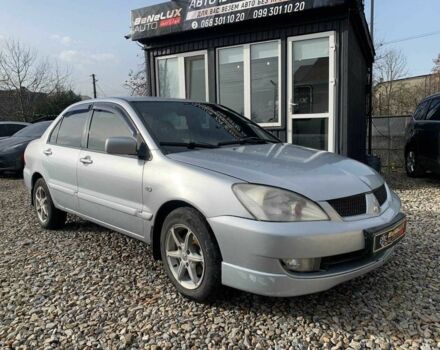 Серый Мицубиси Лансер, объемом двигателя 1.6 л и пробегом 227 тыс. км за 3599 $, фото 1 на Automoto.ua