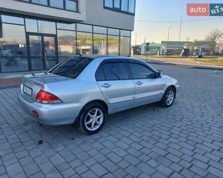 Серый Мицубиси Лансер, объемом двигателя 1.6 л и пробегом 228 тыс. км за 2999 $, фото 12 на Automoto.ua