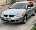 Сірий Міцубісі Lancer, об'ємом двигуна 1.58 л та пробігом 232 тис. км за 5300 $, фото 1 на Automoto.ua