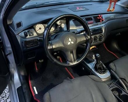 Серый Мицубиси Лансер, объемом двигателя 1.58 л и пробегом 227 тыс. км за 3200 $, фото 12 на Automoto.ua