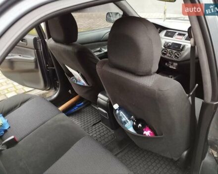 Сірий Міцубісі Lancer, об'ємом двигуна 1.58 л та пробігом 209 тис. км за 2900 $, фото 12 на Automoto.ua