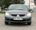 Сірий Міцубісі Lancer, об'ємом двигуна 1.58 л та пробігом 94 тис. км за 6500 $, фото 5 на Automoto.ua