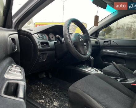 Сірий Міцубісі Lancer, об'ємом двигуна 1.58 л та пробігом 280 тис. км за 4650 $, фото 10 на Automoto.ua