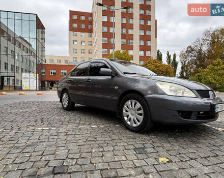 Серый Мицубиси Лансер, объемом двигателя 1.6 л и пробегом 218 тыс. км за 5100 $, фото 9 на Automoto.ua