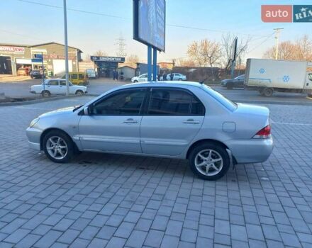 Серый Мицубиси Лансер, объемом двигателя 1.6 л и пробегом 228 тыс. км за 2999 $, фото 19 на Automoto.ua