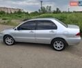 Серый Мицубиси Лансер, объемом двигателя 1.6 л и пробегом 210 тыс. км за 4123 $, фото 3 на Automoto.ua