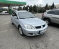 Серый Мицубиси Лансер, объемом двигателя 1.6 л и пробегом 250 тыс. км за 4500 $, фото 1 на Automoto.ua