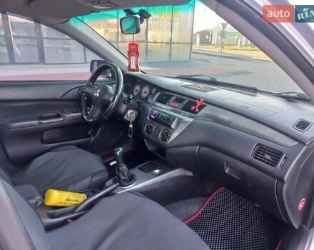 Серый Мицубиси Лансер, объемом двигателя 1.6 л и пробегом 228 тыс. км за 2999 $, фото 30 на Automoto.ua