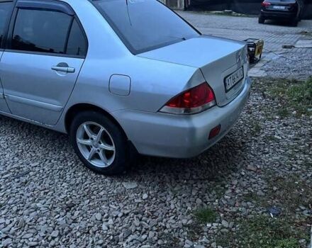 Серый Мицубиси Лансер, объемом двигателя 1.58 л и пробегом 227 тыс. км за 3200 $, фото 5 на Automoto.ua