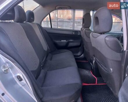 Серый Мицубиси Лансер, объемом двигателя 1.6 л и пробегом 228 тыс. км за 2999 $, фото 24 на Automoto.ua