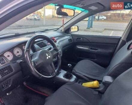 Серый Мицубиси Лансер, объемом двигателя 1.6 л и пробегом 228 тыс. км за 2999 $, фото 22 на Automoto.ua