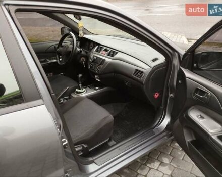 Сірий Міцубісі Lancer, об'ємом двигуна 1.58 л та пробігом 209 тис. км за 2900 $, фото 11 на Automoto.ua