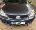 Сірий Міцубісі Lancer, об'ємом двигуна 1.6 л та пробігом 230 тис. км за 3800 $, фото 1 на Automoto.ua