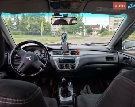 Серый Мицубиси Лансер, объемом двигателя 1.6 л и пробегом 210 тыс. км за 4123 $, фото 4 на Automoto.ua