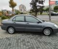 Сірий Міцубісі Lancer, об'ємом двигуна 1.58 л та пробігом 209 тис. км за 2900 $, фото 6 на Automoto.ua
