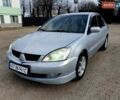 Серый Мицубиси Лансер, объемом двигателя 1.58 л и пробегом 250 тыс. км за 2500 $, фото 1 на Automoto.ua