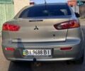 Серый Мицубиси Лансер, объемом двигателя 2 л и пробегом 305 тыс. км за 6500 $, фото 9 на Automoto.ua