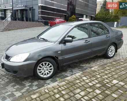 Сірий Міцубісі Lancer, об'ємом двигуна 1.58 л та пробігом 209 тис. км за 2900 $, фото 8 на Automoto.ua