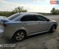 Серый Мицубиси Лансер, объемом двигателя 2 л и пробегом 231 тыс. км за 7500 $, фото 1 на Automoto.ua