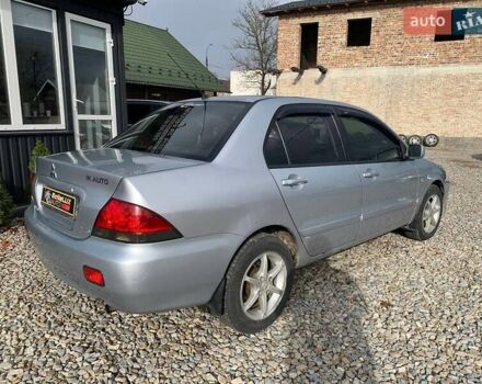 Серый Мицубиси Лансер, объемом двигателя 1.58 л и пробегом 227 тыс. км за 3599 $, фото 3 на Automoto.ua