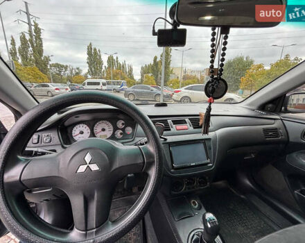 Серый Мицубиси Лансер, объемом двигателя 1.6 л и пробегом 218 тыс. км за 5100 $, фото 19 на Automoto.ua