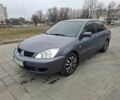 Серый Мицубиси Лансер, объемом двигателя 1.6 л и пробегом 160 тыс. км за 5200 $, фото 1 на Automoto.ua