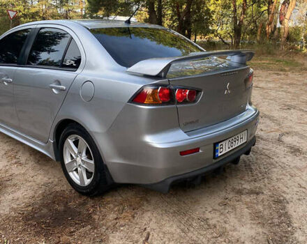 Серый Мицубиси Лансер, объемом двигателя 2 л и пробегом 239 тыс. км за 6999 $, фото 6 на Automoto.ua