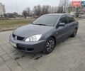 Серый Мицубиси Лансер, объемом двигателя 1.6 л и пробегом 160 тыс. км за 4999 $, фото 1 на Automoto.ua