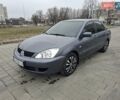 Серый Мицубиси Лансер, объемом двигателя 1.6 л и пробегом 160 тыс. км за 5500 $, фото 1 на Automoto.ua