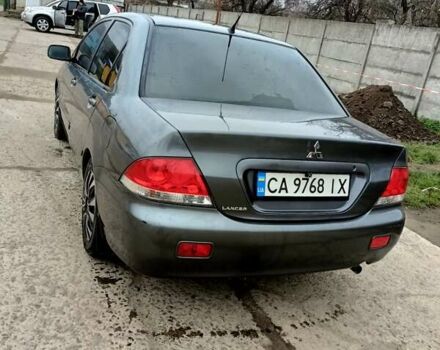 Серый Мицубиси Лансер, объемом двигателя 1.58 л и пробегом 159 тыс. км за 6000 $, фото 2 на Automoto.ua