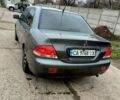 Серый Мицубиси Лансер, объемом двигателя 1.58 л и пробегом 159 тыс. км за 6000 $, фото 2 на Automoto.ua