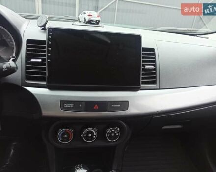 Сірий Міцубісі Lancer, об'ємом двигуна 1.5 л та пробігом 255 тис. км за 7500 $, фото 11 на Automoto.ua