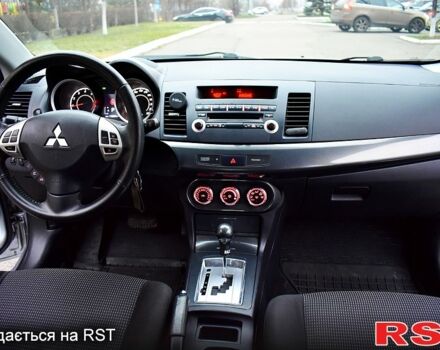 Серый Мицубиси Лансер, объемом двигателя 2 л и пробегом 178 тыс. км за 7400 $, фото 6 на Automoto.ua