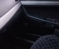 Серый Мицубиси Лансер, объемом двигателя 1.5 л и пробегом 264 тыс. км за 6800 $, фото 3 на Automoto.ua