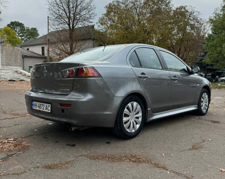 Серый Мицубиси Лансер, объемом двигателя 2 л и пробегом 170 тыс. км за 7400 $, фото 5 на Automoto.ua