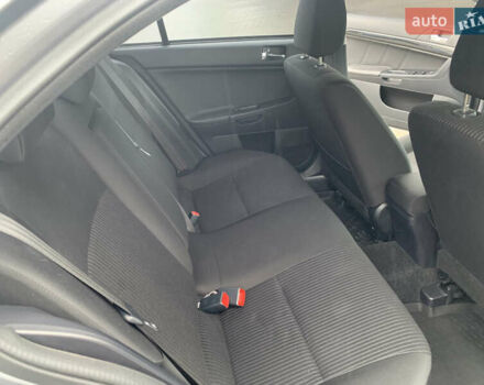 Серый Мицубиси Лансер, объемом двигателя 1.59 л и пробегом 83 тыс. км за 9900 $, фото 31 на Automoto.ua