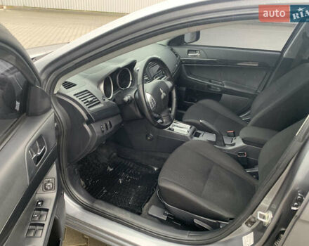 Серый Мицубиси Лансер, объемом двигателя 1.59 л и пробегом 83 тыс. км за 9900 $, фото 24 на Automoto.ua