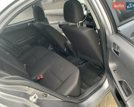 Серый Мицубиси Лансер, объемом двигателя 1.59 л и пробегом 83 тыс. км за 9900 $, фото 27 на Automoto.ua