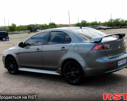 Серый Мицубиси Лансер, объемом двигателя 2 л и пробегом 85 тыс. км за 9700 $, фото 7 на Automoto.ua