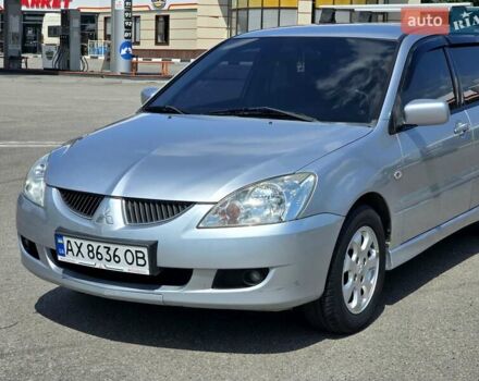 Сірий Міцубісі Lancer, об'ємом двигуна 1.58 л та пробігом 246 тис. км за 4300 $, фото 3 на Automoto.ua