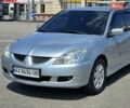 Сірий Міцубісі Lancer, об'ємом двигуна 1.58 л та пробігом 246 тис. км за 4300 $, фото 3 на Automoto.ua