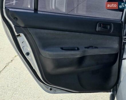 Сірий Міцубісі Lancer, об'ємом двигуна 1.58 л та пробігом 246 тис. км за 4300 $, фото 16 на Automoto.ua