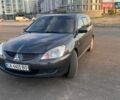 Серый Мицубиси Лансер, объемом двигателя 1.58 л и пробегом 235 тыс. км за 4900 $, фото 1 на Automoto.ua