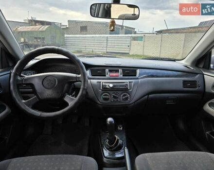 Сірий Міцубісі Lancer, об'ємом двигуна 1.6 л та пробігом 244 тис. км за 4300 $, фото 9 на Automoto.ua