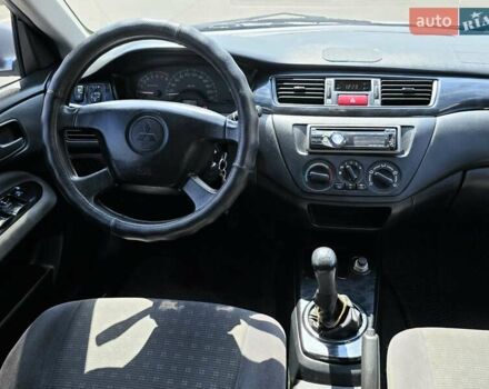 Сірий Міцубісі Lancer, об'ємом двигуна 1.58 л та пробігом 246 тис. км за 4300 $, фото 21 на Automoto.ua