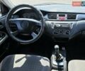 Сірий Міцубісі Lancer, об'ємом двигуна 1.58 л та пробігом 246 тис. км за 4300 $, фото 21 на Automoto.ua