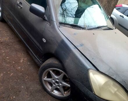 Серый Мицубиси Лансер, объемом двигателя 1.6 л и пробегом 234 тыс. км за 2500 $, фото 5 на Automoto.ua