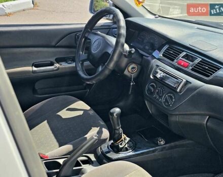 Сірий Міцубісі Lancer, об'ємом двигуна 1.58 л та пробігом 246 тис. км за 4300 $, фото 24 на Automoto.ua