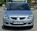 Сірий Міцубісі Lancer, об'ємом двигуна 1.58 л та пробігом 246 тис. км за 4300 $, фото 2 на Automoto.ua