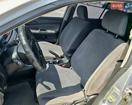 Сірий Міцубісі Lancer, об'ємом двигуна 1.58 л та пробігом 246 тис. км за 4300 $, фото 15 на Automoto.ua